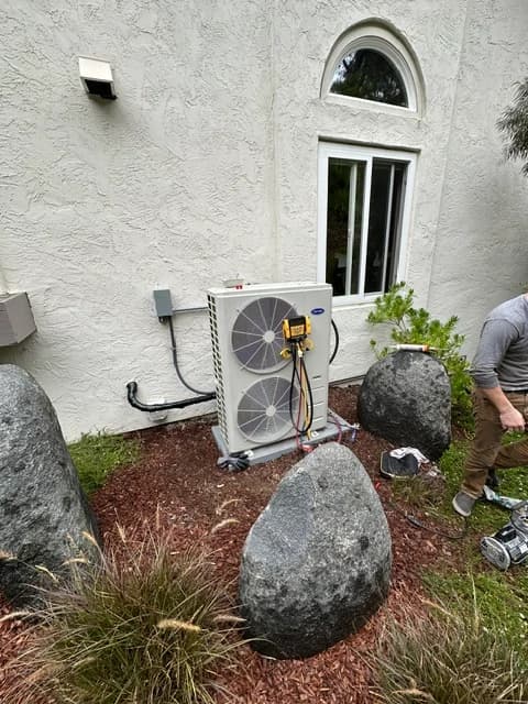 Caspian Air HVAC technician installing a system in San Diego